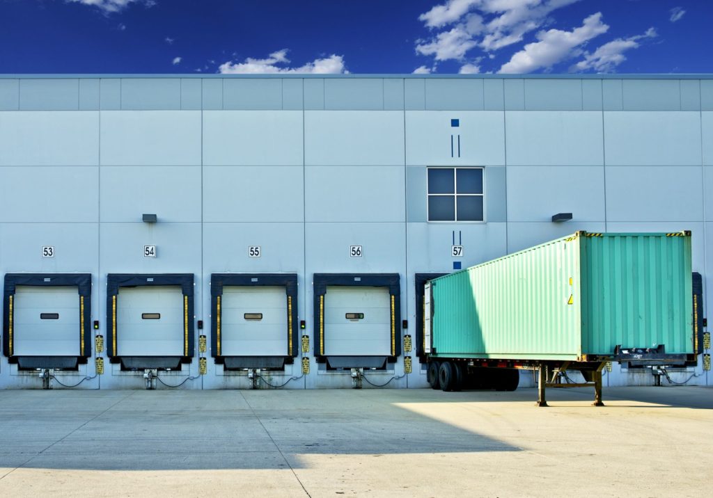 Trailer at a warehouse receiving dock for a self-filing importer